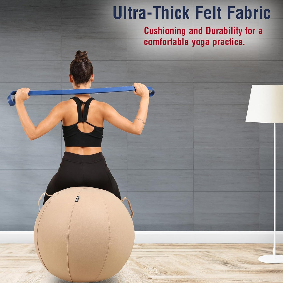 Woman using a brown covered exercise ball for yoga and Pilates at home